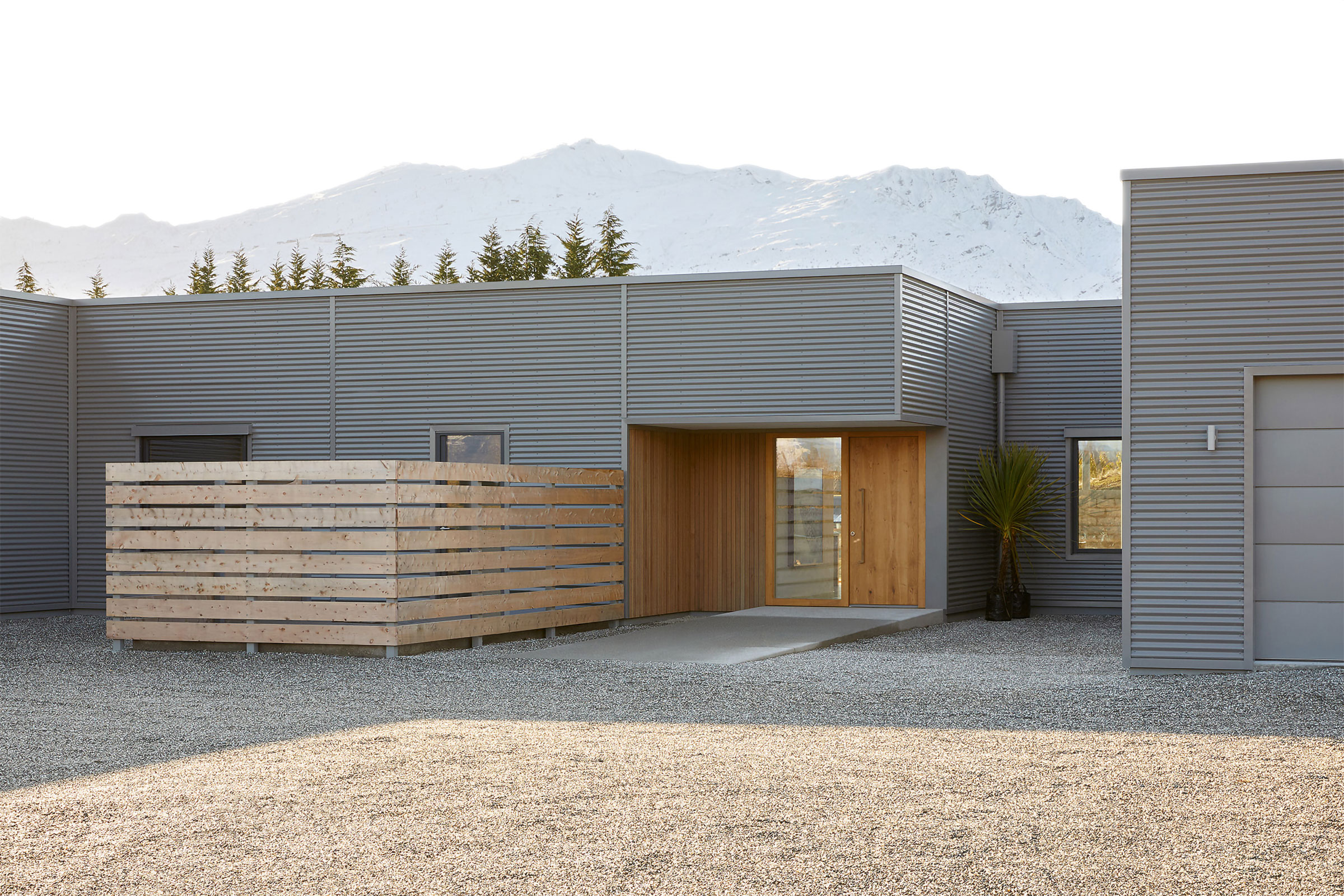 Slope Hill house exterior with snowy mountains
